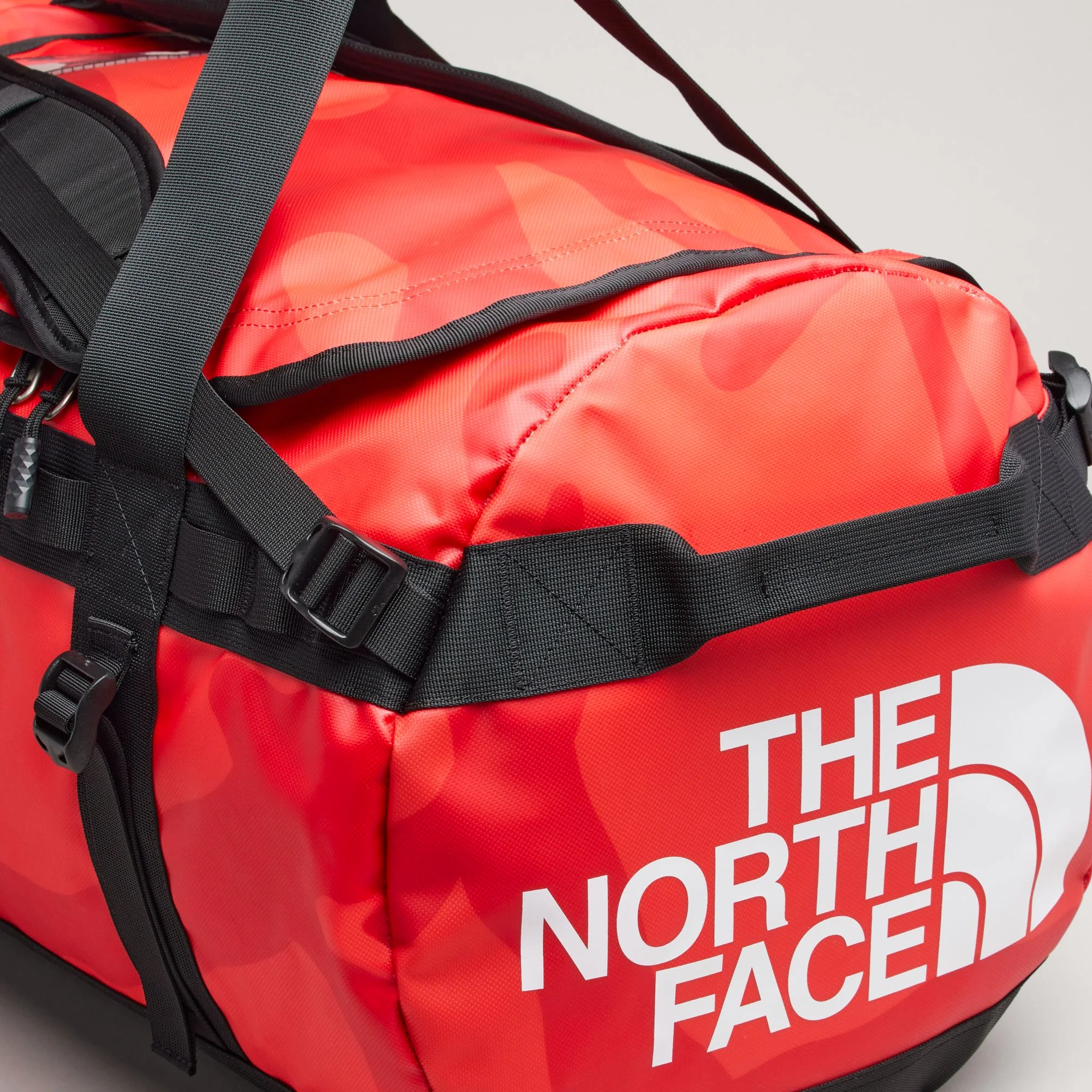 The North Face XX Kaws Basecamp Duffel Bag 'Brilliant Coral 86 Print' - Image 4